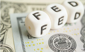 Fed Officials Signal Restrictive Rates May Be Needed ‘For Some Time'